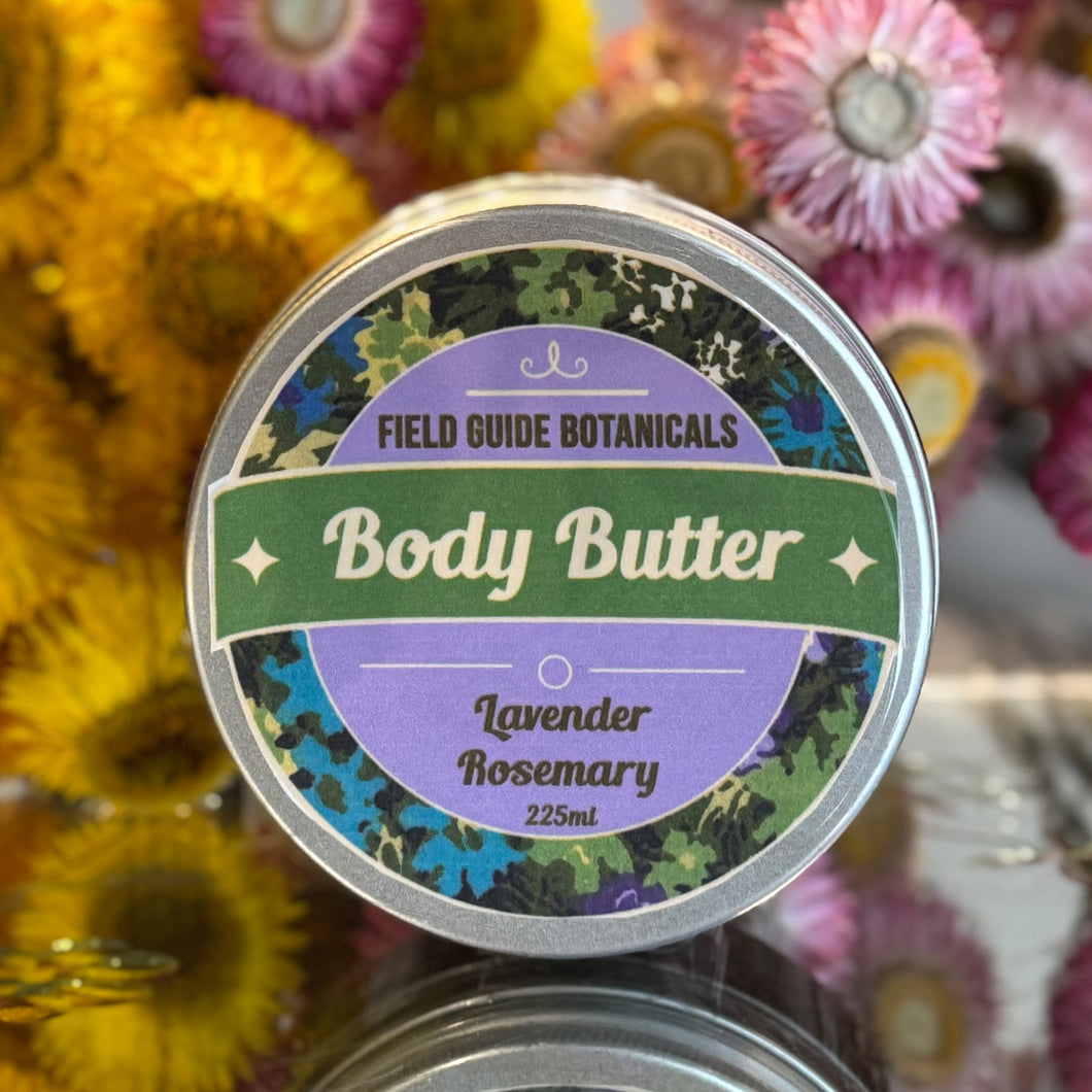 a 225 ml tub of lavender and rosemary body butter in front of dried straw flowers